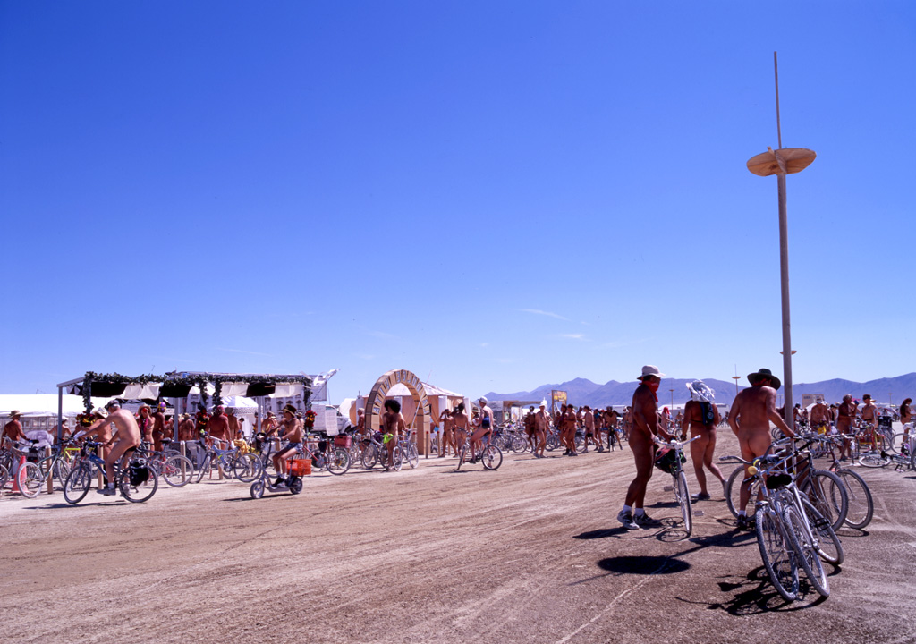 A whole lot of nude men on bicycles